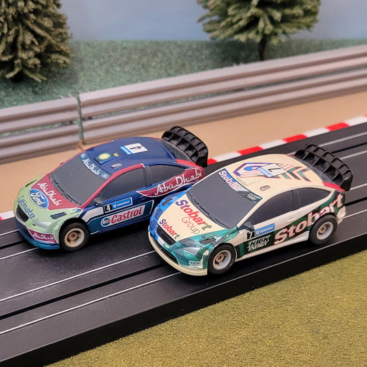 Micro Scalextric Pair 1:64 Cars - Ford Focus WRC Stobart & Abu Dhabi #A