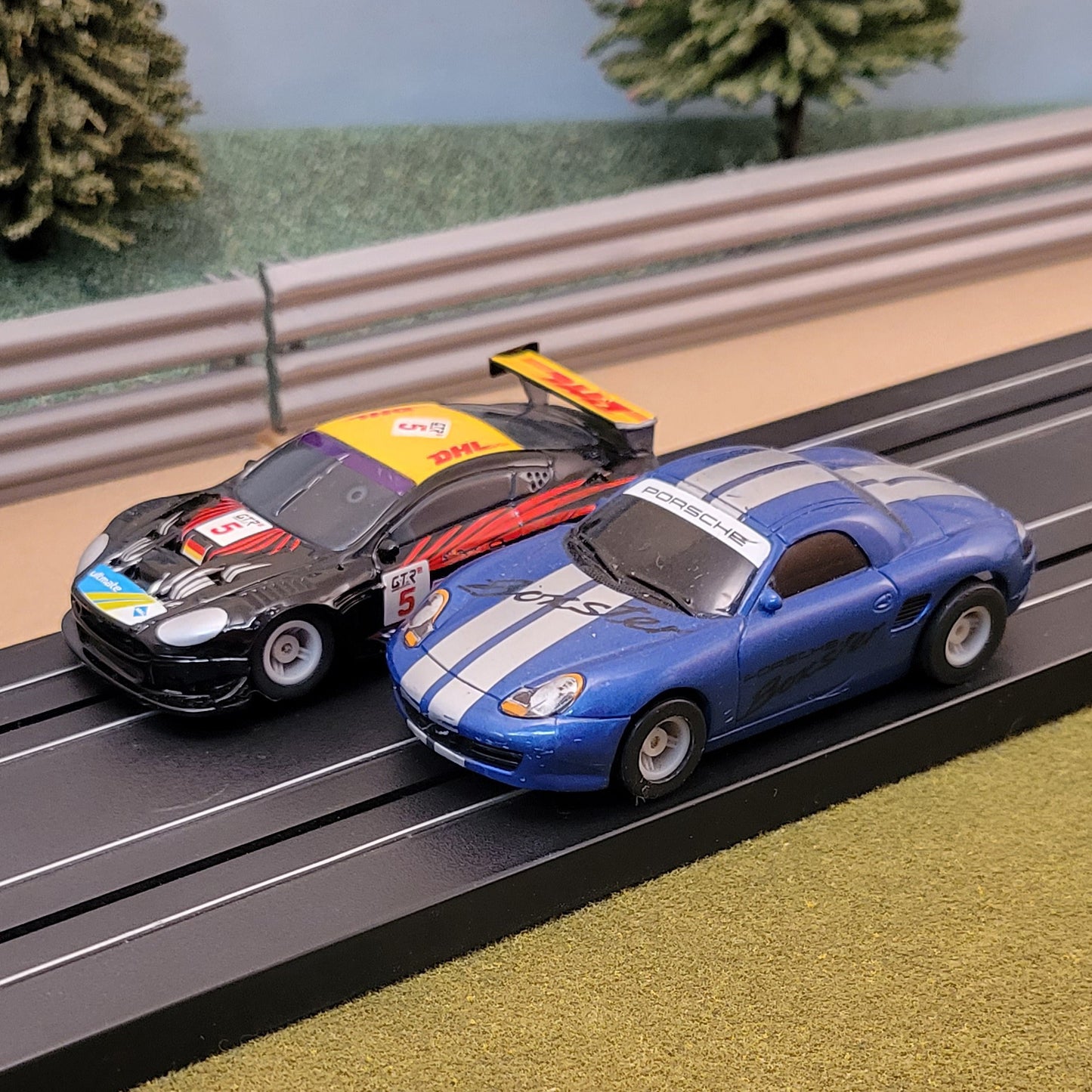 Micro Scalextric Pair 1:64 Cars - Aston Martin DBR9 DHL & Blue Porsche Boxster