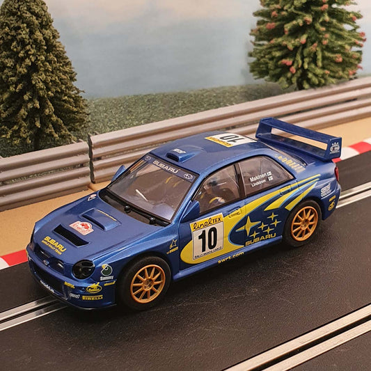 Coche Scalextric 1:32 - C2412 Subaru Impreza WRC Makinen #10 *LUCES* #W